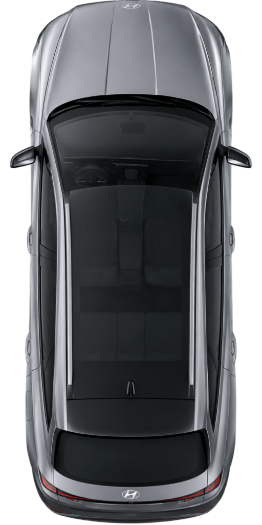 Top-down view of a silver Hyundai SUV showing the roof and interior seating visible through the glass roof